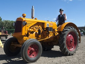 People drive tractors the Western Development Museum during the Pion-Era event in Saskatoon, SK. on Sunday, July 13, 2014.