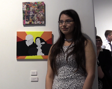 Tonia Bird stands near one of her pieces in Urban Canvas' final show of the year.