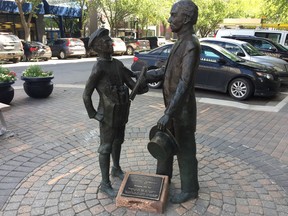 The statue at First Avenue and 21st Street showing a meeting between a young John Diefenbaker and Prime Minister Wilfrid Laurier. Jonathan Charlton/Saskatoon StarPhoenix