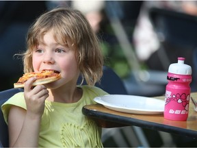 People attend Taste of Saskatchewan south of the Bessborough Hotel on July 14, 2015 in Saskatoon. Brookie Jocelyn had the pizza.