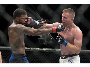 Michael Johnson, left, is hit by Justin Gaethje in a UFC lightweight mixed martial arts bout in Las Vegas, Friday, July 7, 2017. Gaethje won the bout. (Erik Verduzco/Las Vegas Review-Journal via AP) ORG XMIT: NVLAS337

MANDATORY CREDIT; LAS VEGAS SUN OUT; ALSO OUT: KSNV, KVVU, KLAS, KLVX, KTNV, KVCW, KINC, KBLR, NEWS3LV.COM, KTNV.COM, LASVEGASNOW.COM, LASVEGASWEEKLY.COM, FOX5VEGAS.COM, LASVEGAS, CBSLOCAL.COM
Erik Verduzco, AP