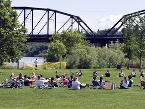 People do a yoga workout in Rotary Park.