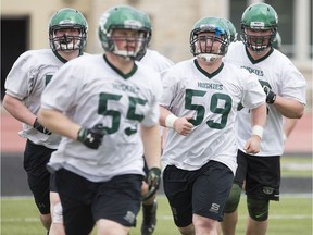 Huskies offensive linemen go through their paces at the team's spring camp earlier this year.