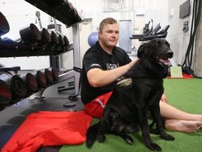 Ret. Cpl. Joseph Rustenburg, from Warman, trains at JB Performance Training with his PTSD service dog Vixen by his side.