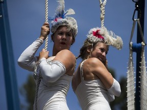 Danielle Gnidec (R) and Molly Keczan (L) perform in front of an audience at the Saskatoon Fringe street fair in Saskatoon, SK on Saturday, August 5, 2017.
