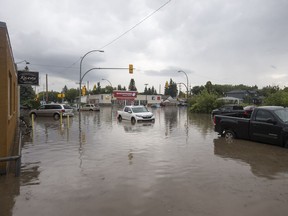 Multiple vehicles were stuck in deep water at the intersection of Taylor Street and Broadway Avenue in Saskatoon, SK on Tuesday, August 8, 2017. (Saskatoon StarPhoenix/Liam Richards)