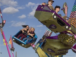People enjoy a ride called Orbiter at the Saskatoon Ex at Prairieland Park in Saskatoon, Sask. on Wednesday, August 9, 2017.