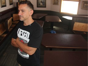 Petro Itskos, stands inside Kisavos Restaurant and Lounge which was flooded on Tuesday during a heavy rain that hit several parts of Saskatoon. He said flooding at the restaurant, which he owns with his family, was made worse when passing cars pushed more water into the business, despite the fact his family asked nearby city workers to close the intersection.