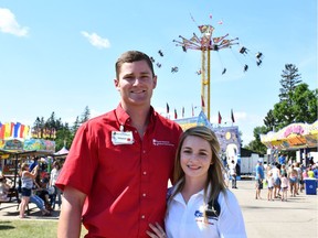 Niki Strauss (right) and her boyfriend Charel Swarts (left) are two of the 137 temporary foreign workers from South Africa currently employed by North American Midway Entertainment.