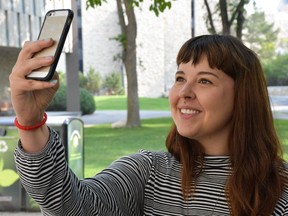 University of Saskatchewan grad student Jennifer Sedgewick, who recently published a psychological study of selfies in dating apps, snaps a picture of herself.