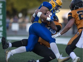 Saskatoon Hilltops running back Logan Fischer runs in for a touchdown against the Ottawa Sooners in Saskatoon on Saturday, August 26, 2017.