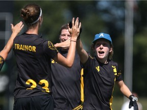 Nova Scotia Anchor's Adria Quigley (right) high fives Tanis Trainor during the ultimate frisbee Canadian mixed championship final at SMF Field on August 27, 2017.