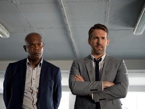 This image released by Lionsgate shows Samuel L. Jackson, left, and Ryan Reynolds in &ampquot;The Hitman&#039;s Bodyguard.&ampquot; (Jack English/Lionsgate via AP)