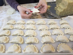 Myrna Olynick and employees pinching thousands of perogies at A and R Perogies, December 30, 2015.