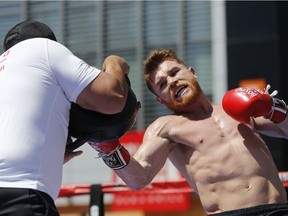 Boxer Canelo Alvarez works out as he hosts an open-to-the-public media workout at L.A. LIVE in Los Angeles on Monday, Aug. 28, 2017