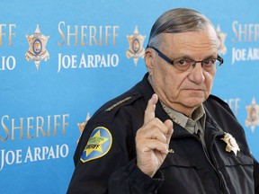 In this Dec. 18, 2013, file photo, Maricopa County Sheriff Joe Arpaio speaks at a news conference at the Sheriff's headquarters in Phoenix, Ariz. President Donald Trump has pardoned former sheriff Joe Arpaio following his conviction for intentionally disobeying a judge's order in an immigration case. The White House announced the move Friday night, Aug. 25, 2017, saying the 85-year-old ex-sheriff of Arizona's Maricopa County was a "worthy candidate" for a presidential pardon.