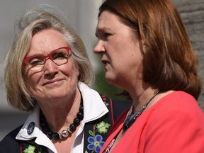 Carolyn Bennett (left), minister of Crown-Indigenous relations and northern affairs looks on as Indigenous Services Minister Jane Philpott speaks to media after a Liberal cabinet shuffle at Rideau Hall in Ottawa on Monday, Aug. 28, 2017.