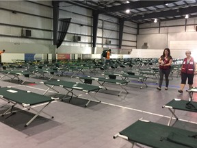 Red Cross workers prepare emergency shelter for forest fire evacuees on Aug. 29, 2017 at Henk Ruys Soccer Centre in Saskatoon.