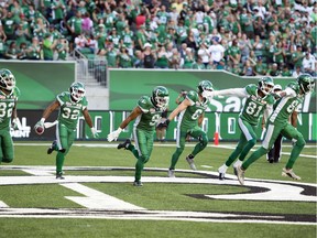 The Saskatchewan Roughriders celebrate a Cameron Marshall touchdown Sunday against the B.C. Lions.