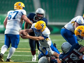 Saskatoon Hilltops quarterback Jordan Walls reaches across the goal-line during a game against the Regina Thunder at Mosaic Stadium in Regina on August 12, 2017.