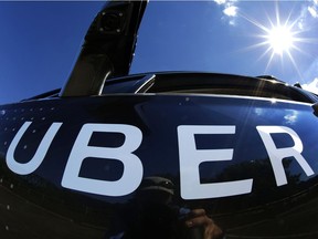 In this Monday, Sept. 12, 2016, file photo, a self-driving Uber sits ready to take journalists for a ride during a media preview in Pittsburgh.