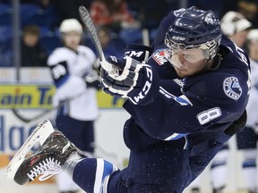 MacKenzie Johnston takes a slap shot at the Saskatoon Blades' skills competition on January 26, 2014.