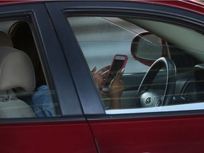 A distracted driver behind the wheel.