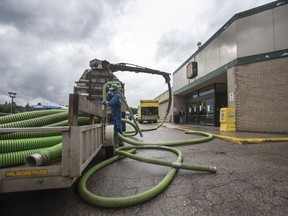 BESTPHOTO  SASKATOON,SK--AUGUST 08/2017-0809 News Flooding- Employees of McGill's Industrial Services work to remove water from Market Mall after the mall experiences storm water issues from heaven rain fall in Saskatoon, SK on Tuesday, August 8, 2017. (Saskatoon StarPhoenix/Liam Richards)
Liam Richards, Saskatoon StarPhoenix