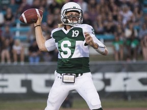 Huskies' quarterback Kyle Siemens throws the football during the team's home opener.