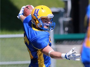 Saskatoon Hilltops' Ryan Turple scores a touchdown during their 2016 Prairie Football Conference season-opener against the Winnipeg Rifles at SMF Field on August 14, 2016