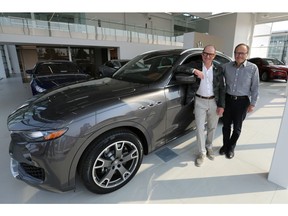 Vaughn Wyant (left), who has opened a Maserati / Alfa Romeo dealership in the city, stands with dealership general manager Brian Kelly. (Michelle Berg / Saskatoon StarPhoenix)