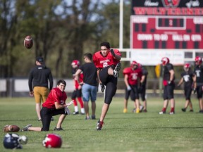 Players from the Warman Wolverines high school football team practice recently.