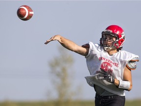 Warman Wolverines quarterback Tristen Denis throws during a recent team practice.