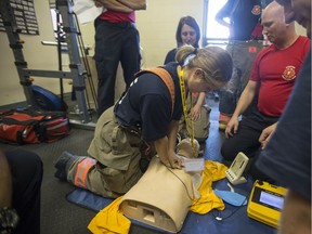 Star Phoenix reporter Andrea Hill is taught skills by the Saskatoon Fire Department at Fire station #6 in Saskatoon, SK on Friday, September 8, 2017.