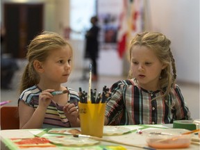 Ruby Black, age four, (L) and Kessandra Wiens, age five, work on an art project during a media event to announce funding to the Children's Discovery Museum on the Saskatchewan at the Mendel Art Gallery in Saskatoon, September 12, 2017.