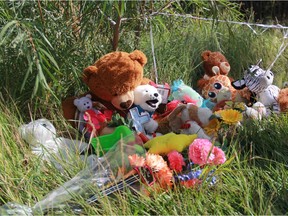 Stuffed animals and balloons sit at the edge of a retention pond near Ecole Dundonald on Tuesday, Sept. 12, 2017. The memorial is in tribute to a five-year-old boy who drowned in the retention pond on Monday, Sept. 11, 2017. The Office of the Chief Coroner is investigating the death, as police consider it non-suspicious. (Morgan Modjeski/The Saskatoon StarPhoenix)