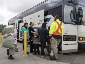 Residents of the Pelican Narrows area, who had been evacuated due to fire, load on to buses to return home at the Henk Ruys Soccer centre in Saskatoon, SK on Thursday, September 14, 2017. 
Liam Richards, Saskatoon StarPhoenix