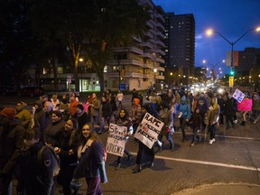 A crowd of marchers turns onto 25th Street during the annual Take Back The Night march to raise awareness of sexual violence in Saskatoon, SK on Thursday, September 21, 2017. (Saskatoon StarPhoenix/Kayle Neis)