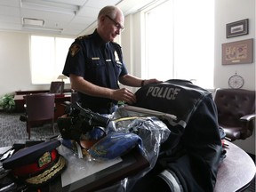 Outgoing police chief Clive Weighill packs up his office at Saskatoon Police Service headquarters on September 26, 2017.