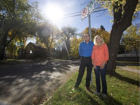 Dennis and Patricia Dowd stand near a parking sign on their street in Saskatoon, SK on Friday, September 29, 2017. The Dowds want the city to reconsider the 36-hour time limit for on-street parking. They feel it puts an unfair burden on homeowners like them who do not have a driveway or a garage and that the limit makes no sense in a city that is trying to encourage residents to walk, cycle and take the bus.(Liam Richards/Saskatoon StarPhoenix)