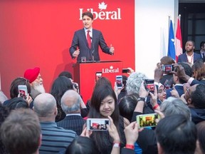 Supporters take pictures of Prime Minister Justin Trudeau as he speaks at a Liberal party fundraiser Thursday, May 4, 2017 in Montreal.THE CANADIAN PRESS/Ryan Remiorz