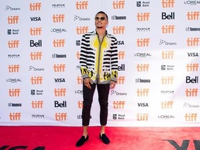 Canadian Olympic sprinter Andre De Grasse poses for photographs on the red carpet for the new documentary &ampquot;The Carter Effect&ampquot; during the 2017 Toronto International Film Festival in Toronto on Saturday, September 9, 2017. THE CANADIAN PRESS/Nathan Denette