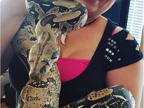 Elisa Wilke with Pip, a five-foot boa that was rescued in Saskatoon on Sunday. Pip is in Wilke's care for a month until it is adopted by someone outside of Saskatchewan.