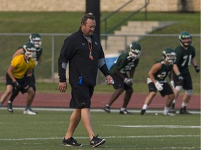 Scott Flory walks downfield as his team goes through drills during a recent Huskies practice.