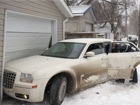 Two men have received lengthy prison sentences in connection with a shooting and police chase that ended when a stolen car crashed into a garage in Saskatoon in March 2015. (LIAM RICHARDS/THE STAR PHOENIX)