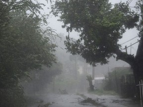 High winds and rain sweep through the streets of the Matelnillo community during the passage of hurricane Irma, in Fajardo, Puerto Rico, Wednesday, Sept. 6, 2017. The US territory was first to declare a state of emergency las Monday, as the National Hurricane Center forecast that the storm would strike the Island Wednesday. (AP Photo/Carlos Giusti)