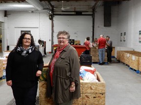 Laurie O'Connor, the executive director of the Saskatoon Food Bank, and Karen Wasylenko, president of the Health Sciences Association of Saskatchewan, are kicking off the national Hunger Awareness Week with some help from volunteers at the Saskatoon Food Bank and Learning Centre in Saskatoon on September 18, 2017.