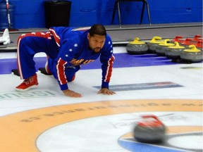 Harlem Globetrotter 'Handles' Franklin celebrates throws a rock at CN Curling Club in Saskatoon on Friday, September 22, 2017. Franklin was in Saskatoon promoting the upcoming Globetrotters' event at SaskTel Centre on Oct. 1 and took some time to take curling lessons from professional curler Kirk Muyres.