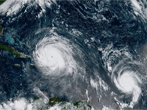 In this GOES-16 geocolor image satellite image taken Thursday, Sept. 7, 2017, the eye of Hurricane Irma, left, is just north of the island of Hispaniola, with Hurricane Jose, right, in the Atlantic Ocean. Irma, a fearsome Category 5 storm, cut a path of devastation across the northern Caribbean, leaving at least 10 dead and thousands homeless after destroying buildings and uprooting trees on a track Thursday that could lead to a catastrophic strike on Florida.