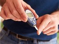 A diabetic man checks his blood sugar levels.
Monkey Business Images, Vancouver Sun